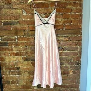 Pink lace slip dress with bow and mesh detailing